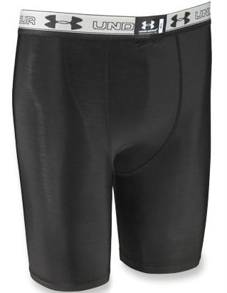 Black Under Armour compression shorts with a white elastic waistband featuring the brand’s logo and name. These moisture wicking underwear offer a fitted design and extend to just above the knee.