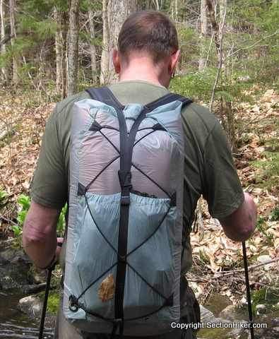 Some backpacks have tie out loops that let you rig up custom cord systems for attaching gear to the rear of your pack.Pack Shown: Mountain Laurel Designs Newt (I think!)