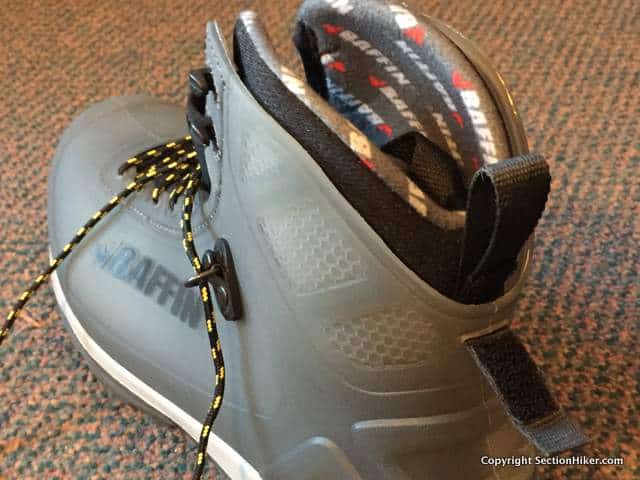 The insulated inner boot locks into the rear of the waterproof shell with a velcro strap