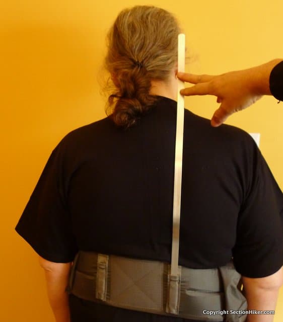 Press the stay against your back to identify gaps or pressure points where a bend is needed