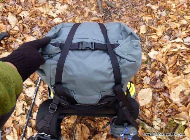 The roll top closure buckles closed on top of the packbag and is held in place by a Y strap. 