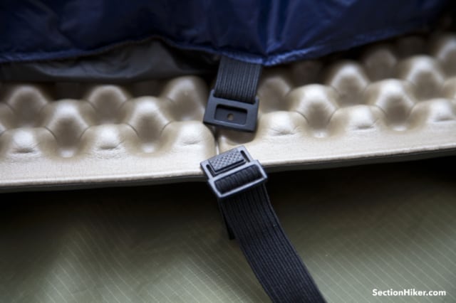 Enlightened Equipment straps have a wafer-style buckle which is easy to reattach in the dark.