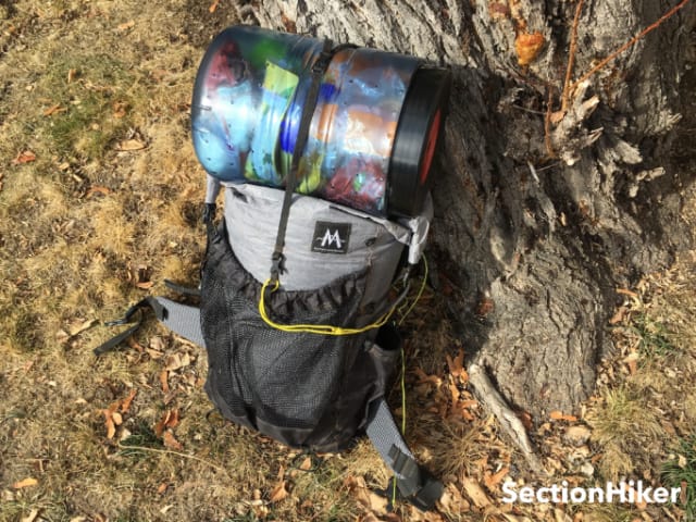 You’ll want to pack a frameless pack “full” to create a flat top for carrying a canister.