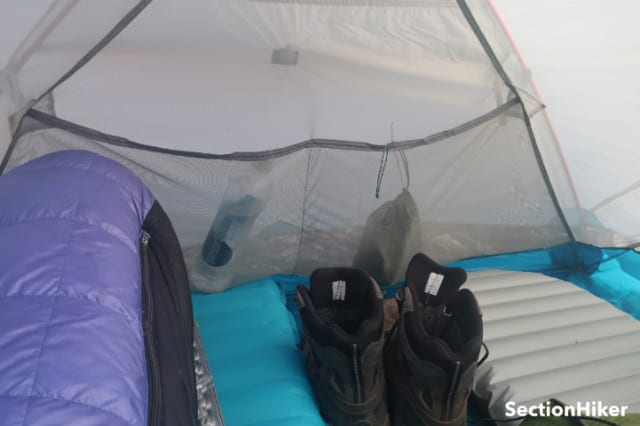 There are large mesh pockets at each end of the tent that can hold a ton of personal items