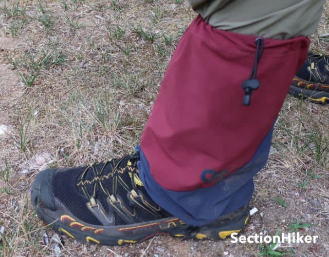 The Ferrosi Thru-Gaiter has an adjustable elastic strap to prevent them from falling down. It doesn’t work very well.