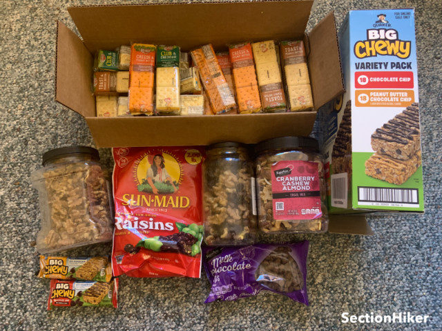 My staple winter hiking snacks - cracker sandwiches, soft granola bars that don’t freeze, home made gorp ingredients, and store-bought gorp.