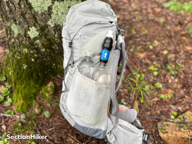 The side pockets are large enough to store 2 x one liter Smartwater bottles or 32 oz Nalgene bottles.
