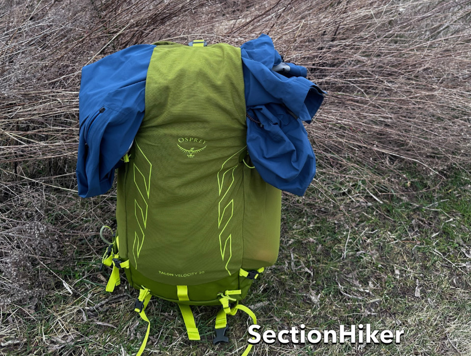 The stretchy top flap can also be use to hold gear on top of the pack like a floating lid.