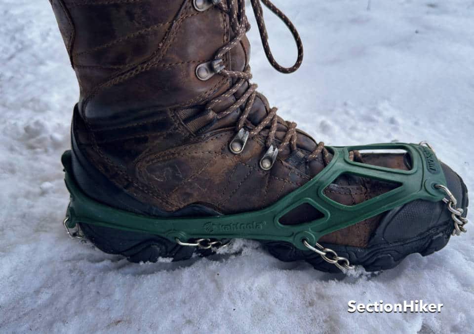 The elastomer harness slips over boots and shoes