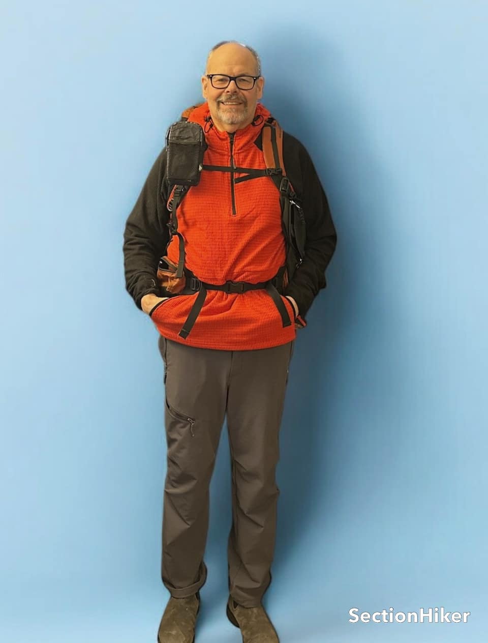 You can stick your hands into the kangaroo pocket when wearing a backpack hipbelt.