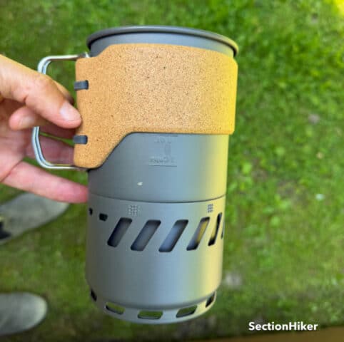 The Switch has a heat exchanger pot with a cork grip ad flding metal handles.